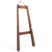 A carved oak walking stick rack, 79cm