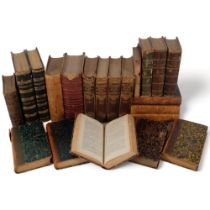A collection of part leather bound books, including The Complete Works of Shakespeare, a Memoir, and