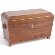 A Regency rosewood tea caddy of sarcophagus form, fitted with 2 inner boxes and lids, mixing bowl