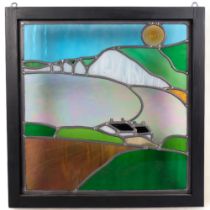 A modern coloured leadlight glass panel, depicting the Cuckmere Haven, 53cm x 53cm overall, framed