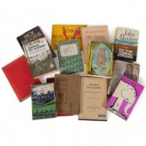 A collection of various first edition and other books, including Daphne Du Maurier Rule Britannia