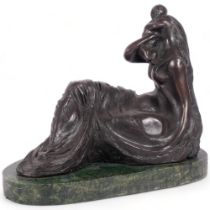 A stylised bronze figural group of a reclining mother and child, on a green marble base,