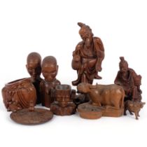 A group of Oriental hardwood carvings, various tourist pieces, including various fish man statue