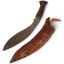 A Malayan kukri in leather scabbard, blade length 30cm, overall length 42cm