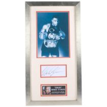 A signed framed photograph of Mike Tyson, 65cm x 35cm