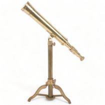 A brass telescope on tripod stand, L46cm