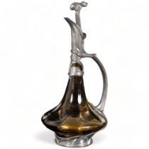 An Art Nouveau pewter mounted Claret jug, H24cm
