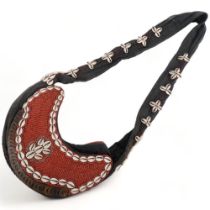 A Southsea Islands cotton and beadwork shoulder bag, with cowrie shell decoration, 29cm across