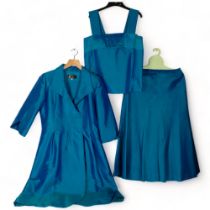 An Oriental style silk turquoise coat jacket, matching skirt and camisole, all matching in colour,