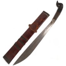 A Philippine machete, with carved animal handle with a leather and bamboo scabbard, blade length