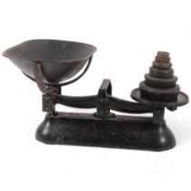 A cast-iron Avery balance scale with Imperial weights.