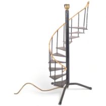 A table lamp modelled as a spiral staircase with metal treads, h56.5cm