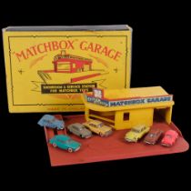 7 French Norev toy cars and a Matchbox garage