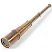 A reproduction brass 4-draw telescope