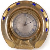 A bronze and blue enamel decorated desk clock, in the form of a horse shoe, with engine turned dial,