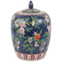 A Chinese porcelain jar and cover with fruit decoration on blue ground, 6 character mark, H37cm