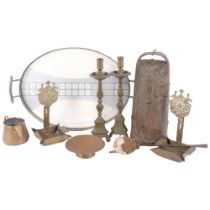 A bronze Portuguese cowbell, 36cm, a pair of Antique brass candlesticks, a pair of wall sconces, and