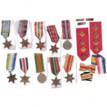 A collection of Second World War medals, cap and tunic badges, including George VI Africa Star,