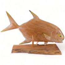 A large carved and painted wooden fish, by Clive Fredriksson, 93cm, with stand (A/F)