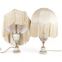 A pair of onyx and gilt-metal table lamps, with frilled shades, H67cm