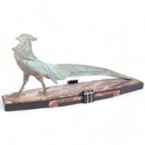 An Art Deco sculpture of a patinated spelter golden pheasant, on shaped marble and black slate base,