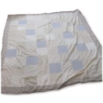 LARA HOLMES, British, a large handmade patchwork bed cover, silk, linen and cotton panels with