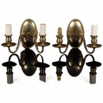 A pair of brass wall sconces with ram's head decoration (2)