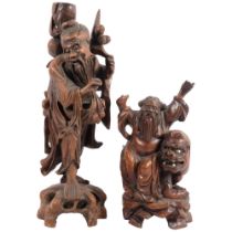 A carved wood Oriental figure, 48cm, and a smaller figure with mythical beast