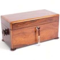 A Regency rosewood tea caddy of rectangular form, with fitted lidded boxes (no mixing bowl),