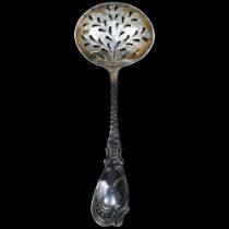 A Georgian silver sifting spoon, with an engraved and pierced tree design bowl, L16cm