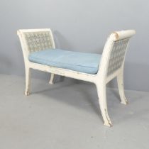 A continental style painted pine window seat, with double cane panelled sides. 97x66x41cm.