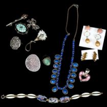 A tray of various silver costume jewellery, including a lapis lazuli bead and oval panel set
