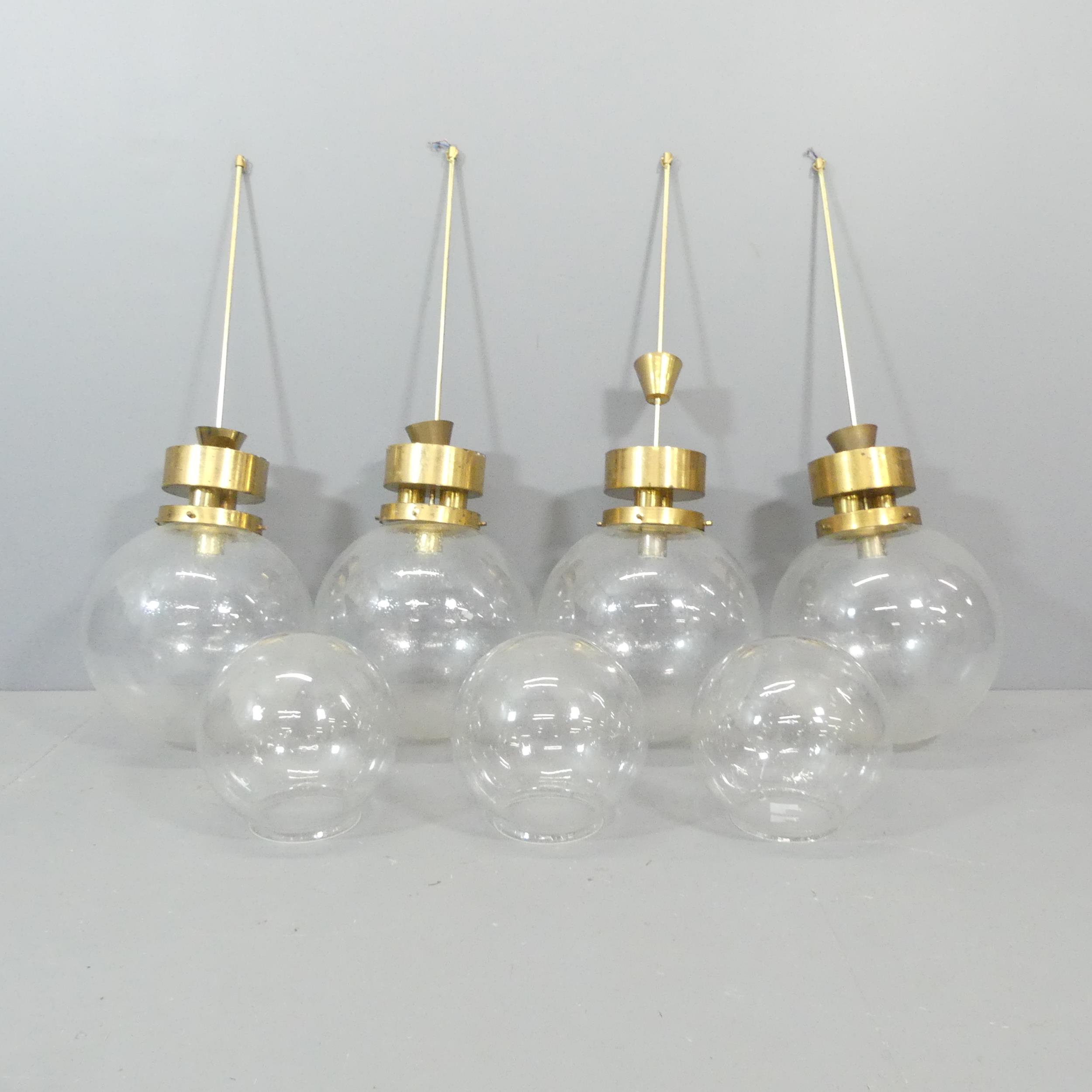 Four mid-century Czech brass bistro lights with Italian hand blown bubble glass globe shades (four