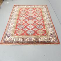 A red-ground Persian rug. 209x155cm.