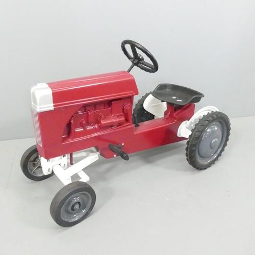 A Ford child's pedal tractor, moulded maker's mark reading "Scale models, Dyersville Iowa, made in