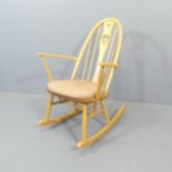 ERCOL - An EC62 rocking chair, with swan detail to back and original maker's gold button. Good
