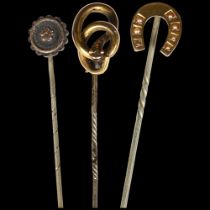 2 Victorian unmarked gold mounted stickpins, 1 in the form of a horseshoe with seed pearl mounts,