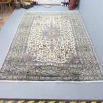 A cream-ground Kashan carpet. 280x195cm.