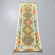 A Chobi Kilim runner. 192x60cm.