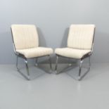 A pair of mid-century design lounge chairs, with rosewood veneered bent-ply seat on tubular metal