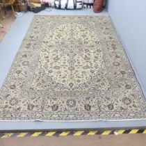 A cream-ground Kashan carpet. 300x199cm.