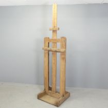 A vintage oak floor-standing easel. Height 192cm. Lower support for canvas has been held in place