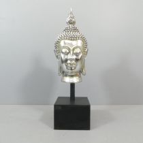 A modern silvered plaster Buddha head sculpture on square wood stand, overall height 100cm.