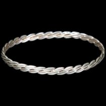 An Elizabeth II silver slave bangle, indistinct maker, London 1986, internal circumference approx