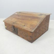 A 19th century oak bible box, with carved decoration. 57x25x42cm.