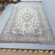 A cream-ground Kashan carpet. 295x190cm. Good condition. No signs of damage or repairs.