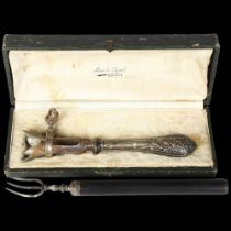 A silver handled ham bone holder, boxes, and a telescopic toasting fork, with silver prongs and