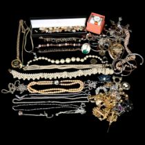 A large quantity of mixed silver and other costume jewellery, wristwatches, etc