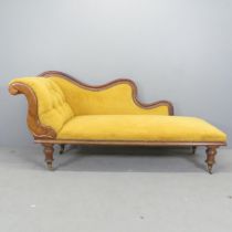 A Victorian mahogany and upholstered chaise longue. 183x88x60cm.