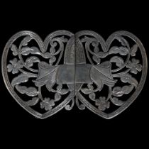 A Victorian silver nurse's buckle, heart-shaped with interwoven floral decoration, hallmarks for